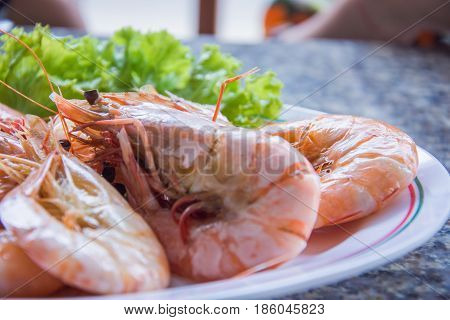 Shrimp boil seafood in the dish selective focus of eye shrimp
