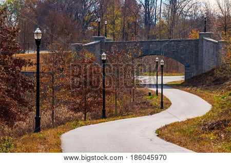 The Piedmont Park Trail and the stone bridge on the Evelyn St NE in autumn day Atlanta USA