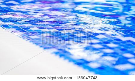 Border Of Indoor Pool With Mosaic Blue And White Tiles