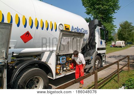 Worker Making Gas Supply On A Tank In The Garden