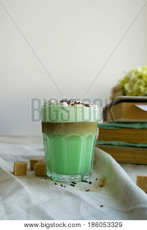 Green mint coffee with with cream and colorful decoration. Milk shake cocktaill frappuccino. Unicorn coffee unicorn food.