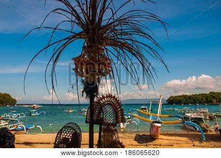 Padangbai Beach. Bali Island Indonesia.the Port With Boats And Traditional Balinese Decorations