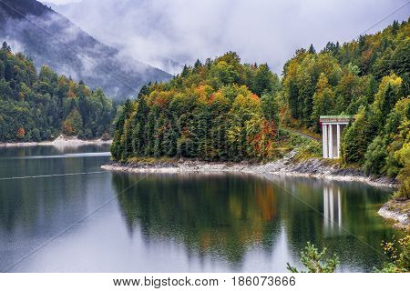 Sylvensteinsee lake in autumn on a cloudy day. Bavaria, Germany