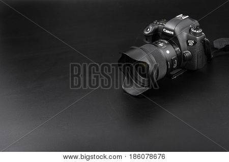 GOMEL BELARUS - May 12 2017: Canon 6d camera with lens on a black background. Canon is the world's largest SLR camera manufacturer