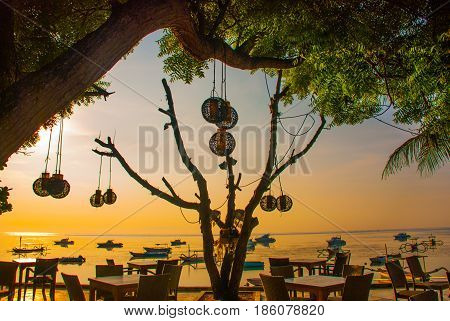 Beautiful Beach With A Cafe In Sanur With Local Traditional Boats. Bali. Indonesia