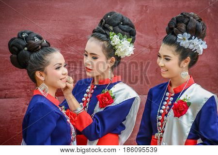 NAKORN PHANOM THAILAND - FEBRUARY 14 2015: Thai northeastern Phutai dancers with traditional costume in Phutai world event day in Renunakorn of Nakorn Phanom Thailand.