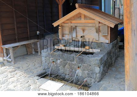 Well for drinking water on Naraijyuku historical house street in Kiso Nagano Japan. Naraijyuku is famous for preserved traditional houses and accommodation.