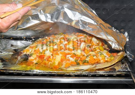 Roasting A Tambaqui Fish With Vegetables
