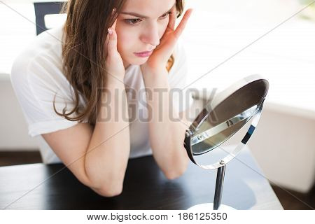 Woman With A Mirror
