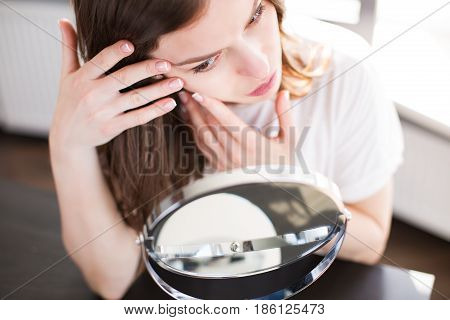 Woman With A Mirror