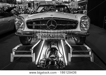 STUTTGART GERMANY - MARCH 02 2017: Sports car Mercedes-Benz 230SL (W113) Pagoda 1965. Black and white. Europe's greatest classic car exhibition 
