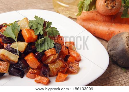 Salad baked beetroot fresh carrots and potatoes. Healthy food from organic products