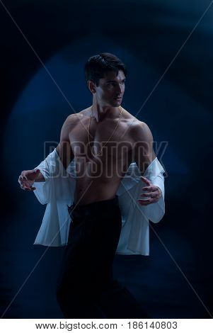 The paranormal vampire is in a suggestive pose.