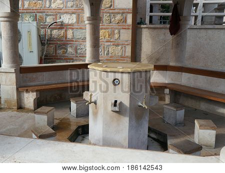 SKOPJE, MACEDONIA - MARCH 9, 2017:  15 century Mosque Jamia, the bath for legs and feet