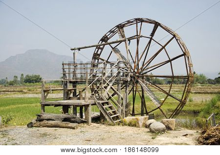 Big Wooden Turbine Baler Water Wheel At Thai Dam Cultural Village In Chiang Khan At Loei, Thailand
