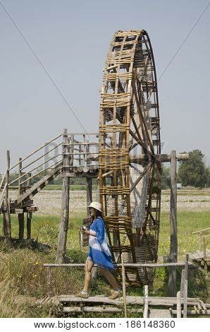 Thai Women People Travel And Posing With Big Wooden Turbine Baler Water Wheel