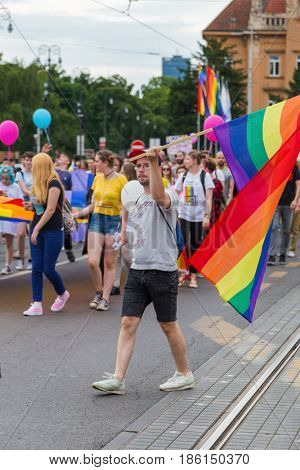 ZAGREB, CROATIA - JUNE 11, 2016: 15th Zagreb pride. LGBTIQ activist holding flag.