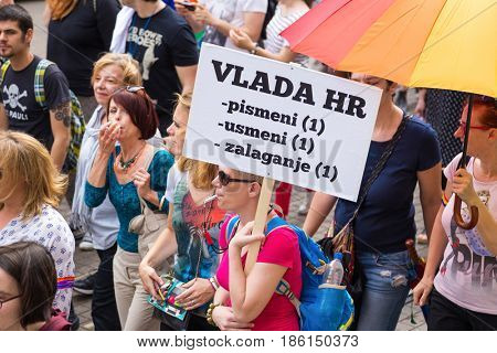 ZAGREB, CROATIA - JUNE 11, 2016: 15th Zagreb pride. LGBTIQ activist holding banner.