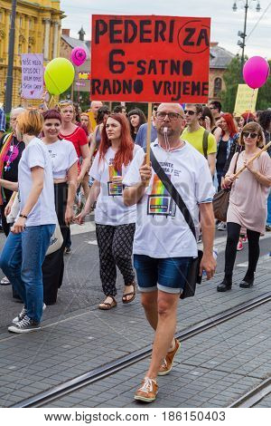 ZAGREB, CROATIA - JUNE 11, 2016: 15th Zagreb pride. LGBTIQ activist holding banner.