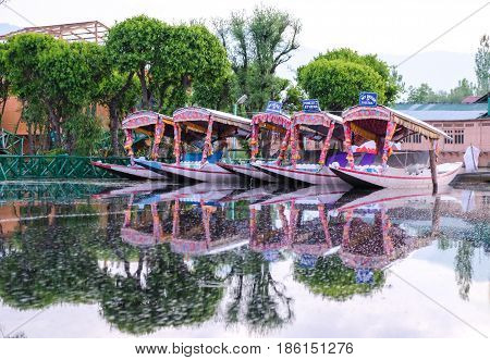 Srinagar India - 25 April 2017 : Shikara a small boat People use for transportation in the Dal lake of Srinagar Jammu and Kashmir state India.