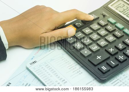 Hand calculate finance. Bank account on white background.