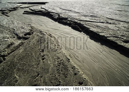 Dried creek with a pattern on the sand. Siberia, spring, the Ob Sea.