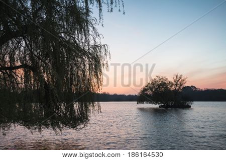 Beautiful Vibrant Spring Sunrise Over Calm Lake In English Countryside