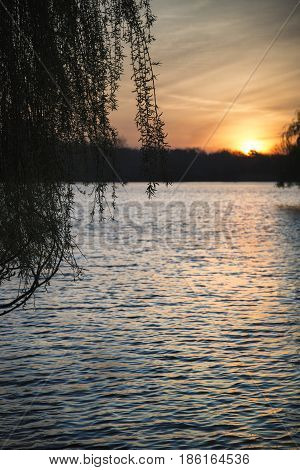 Beautiful Vibrant Spring Sunrise Over Calm Lake In English Countryside