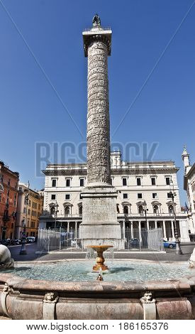 Rome, Italy - March 12, 2017:Fountain in Piazza Colonna in Rome. Famous for the Column of Marcus Aurelius in Rome. Ital