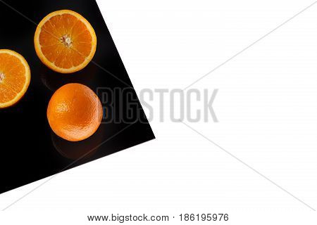Orange on Black Sheet Isolated on white.