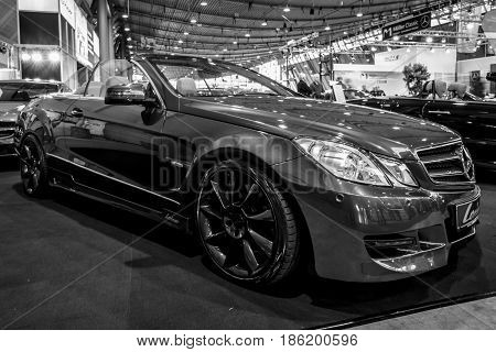 STUTTGART GERMANY - MARCH 02 2017: Mid-size luxury sports car Mercedes-Benz E500 (A207) 2010. Black and white. Europe's greatest classic car exhibition 