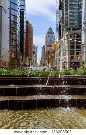 NEW YORK CITY USA - 04 2017 : The water in the fountain and splash water fountain on the background of New York