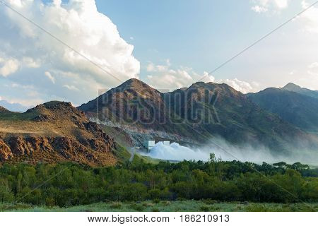 Bartogai dam on a mountain river Chilik Kazakhstan upcast of water