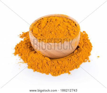 turmeric powder in bolw on white background. top view