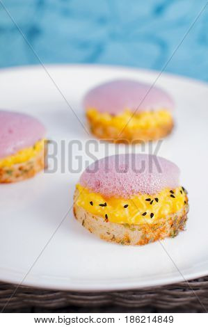 Spicy crostini filling eggs and vegetable foam