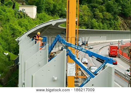 Workers During The Installation Of Noise Barriers On The Highway