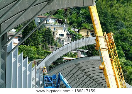 Workers During The Installation Of Noise Barriers On The Highway