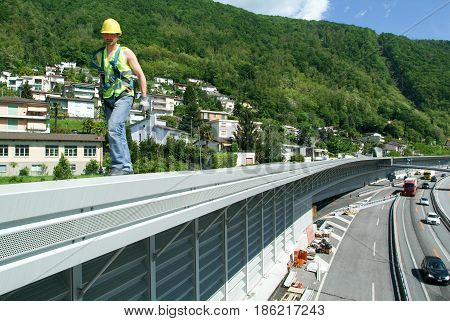 Workers During The Installation Of Noise Barriers On The Highway