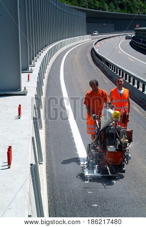 Machine Eject And Worker On Road And Traffic Sign Painting
