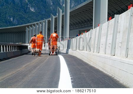 Machine Eject And Worker On Road And Traffic Sign Painting