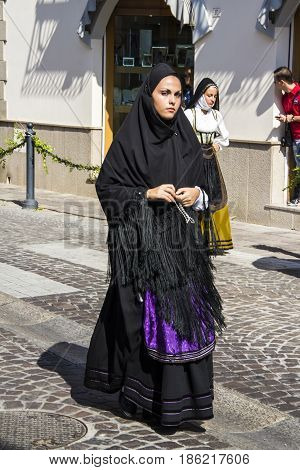 SELARGIUS, ITALY - SEPTEMBER 9, 2012: Ancient celibacy salad - portrait of a beautiful woman of the folk group  S'arramini of Isili - Sardinia