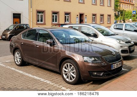 RASSTAT GERMANY - APR 13 2017: Front view of maroon topaze new Skoda Octavia estate car parked in dedicated parking place in Rasstat Germany Baden Wurtemberg