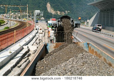 Workers And Vehicles During The Road Milling Of The Highway
