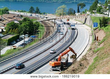 Hydraulic Digger Breaking Up A Wall