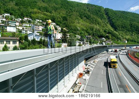 Workers During The Installation Of Noise Barriers On The Highway