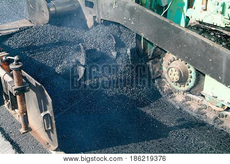 Workers And Vehicles During The Asphalting Of The Highway