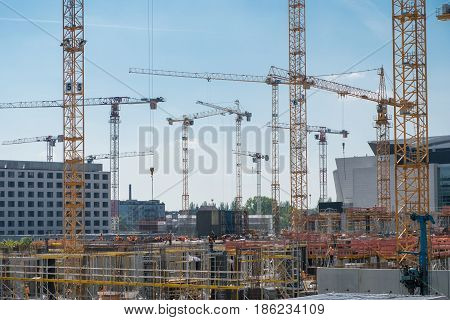 Cranes And Construction Workers Onconstruction Site