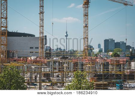 Cranes And Construction Workers Onconstruction Site