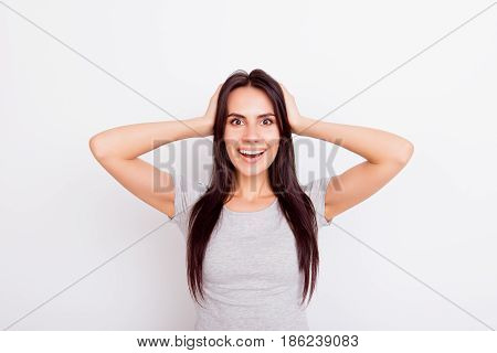 Wow! Really?! Close Up Portrait Of Cute Amazed Girl Looking Stright And Holding Her Head, Smiling, O
