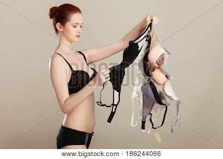 Woman Choosing Bras To Wear